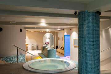 Hydromassage bathtub in hotel wellness center interior