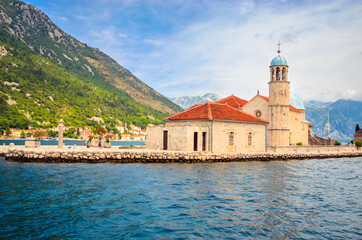 Beautiful mediterranean landscape. Our Lady of the Rock Island near town Perast, Kotor bay, Montenegro.