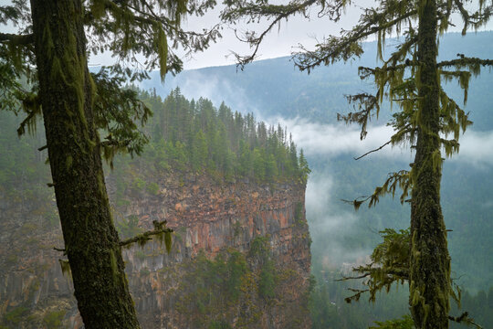 Wells Gray Park Mist Canada. Cliffs and forests in Canada’s Wells Gray Provincial Park.

