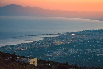 Fototapeta premium Aerial view of Kalamata city, Greece at sunset. Kalamata is one of the most beautiful cities in Greece and a popular tourist destination