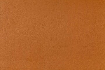 The cement wall is painted brown with a pattern texture and background seamless