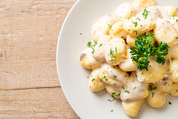 Gnocchi with mushroom cream sauce and cheese