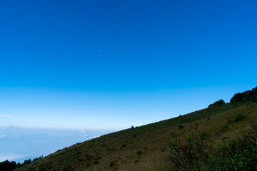 beautiful mountain layer with clouds and blue sky