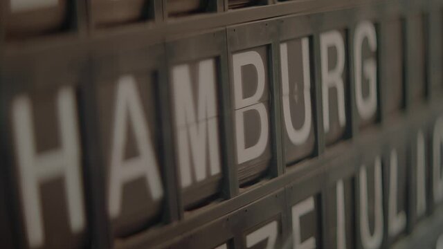 Letters and numbers flip into place on a travel board sign