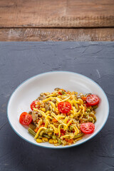 Risotto with mushrooms and cheese and vegetables in a plate.