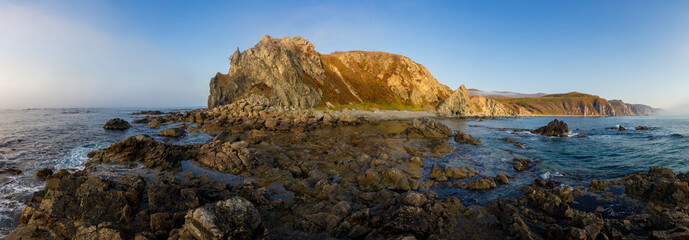 Sikhote-Alin Biosphere Reserve. Panorama. Cape North. Steep rocky coast of the rocky sea coast.