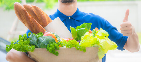 a smiling men good and fast deliver grocery product to customer's home, online shopping during...