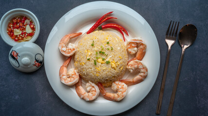 Shrimp fried rice with egg, garnished with spring onions, Asian style