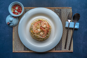 Shrimp fried rice with egg, garnished with spring onions, Asian style