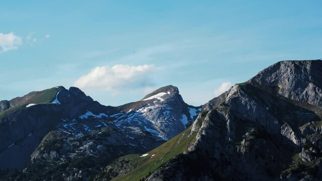 Rofan mountains in Austrian Tyrol, mountain peaks timelapse and  clouds moving. Covered with snow.