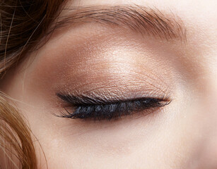 Obraz premium Closeup macro shot of closed human female eye.