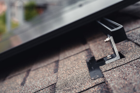 Rail, bracket, and anchor to a solar panel installed on a asphalt shingle roof