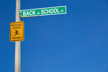Obraz premium Street signs on a pole with a road name Back to School. The concept of safety children on the road. Copy space for your text
