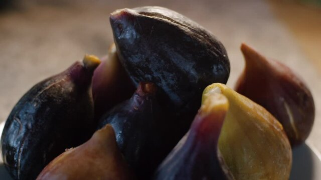 Bowl filled with common figs fruit with studio light, organic vegan food