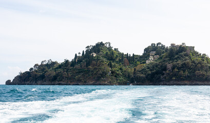 Fototapeta na wymiar Land near Portofino from boat in the sea