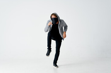 hooded man wearing mask anonymity theft bully sneaks