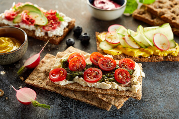 Crispbread toasts with vegetables in table