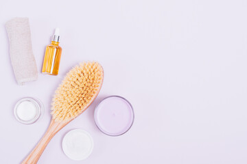 Skincare cosmetic products and wooden massage brush