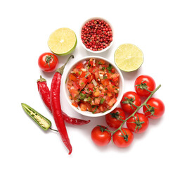 Bowl of tasty salsa sauce and products on white background