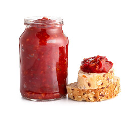 Jar of tasty salsa sauce and bread on white background