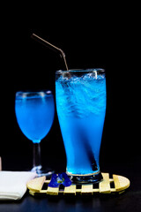 closeup glass of blue hawaii isolated on wooden plate