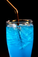 closeup glass of blue hawaii isolated on black