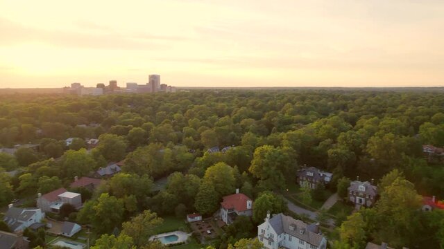 Aerial With Pan To The Right Over Beautiful Clayton Neighborhood In St. Louis, Missouri At Sunset With Skyline On The Horizon.