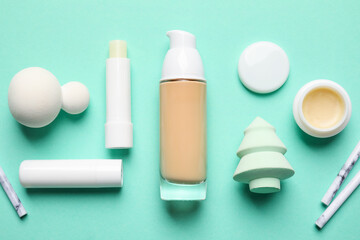 Makeup supplies on color background