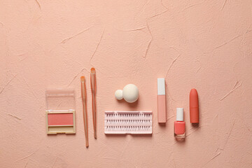 Makeup supplies on color background