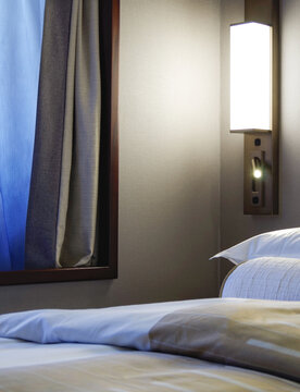 Comfortable double bed with duvet in luxurious oceanview or ocean view or outside or exterior bedroom of cabin or stateroom or suite onboard luxury Azamara cruise ship cruiseship liner