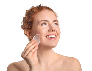 Beautiful young woman with makeup sponge on white background