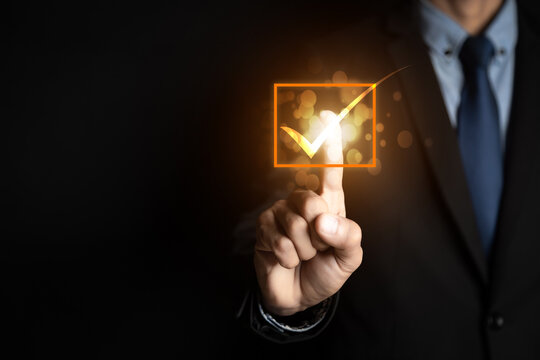 Customer service and Satisfaction concept ,Businessman pressing smiley face emoticon on virtual touch screen. on the happy Smiley face icon to give satisfaction in service. rating very impressed.