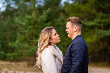 Fototapeta premium Happy loving couple enjoying of happiness love and tenderness, dating, romance.Couple hugging in love at spring park.