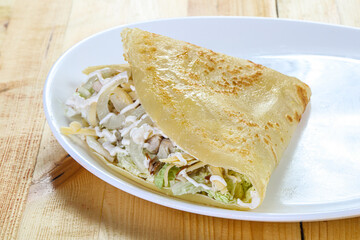 Pancake with chicken caesar salad