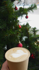 Macro photo Christmas coffee with marshmallows near christmas tree