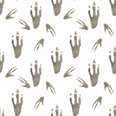 Seamless pattern of dinosaur footprints drawn by hand in watercolor on a white background