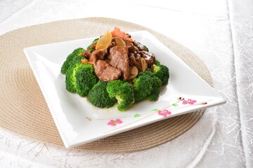 wok stir fried slices meat duck, pork, beef, chicken in soy sauce with broccoli vegetable asian halal menu