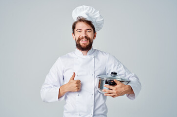 Cheerful male chef kitchenware cooking industry