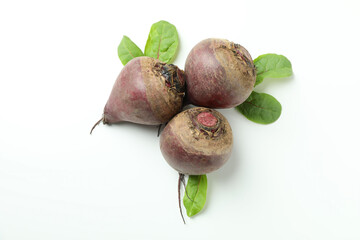 Ripe red beet with leaves on white background