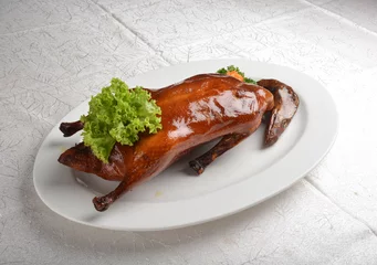 Fotobehang chinese bbq roasted braised whole peking duck meat with slices mango vegetables and herb sauce asian halal menu © perfectloop