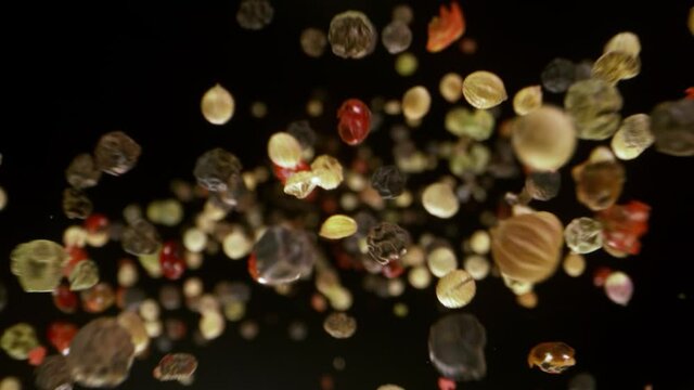Super Slow Motion Detail Shot of Color Pepper Flying Towards Camera at 1000fps.