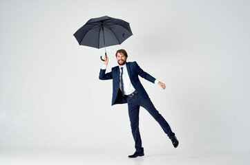 man in suit with umbrella emotions protection from rain