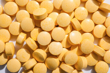 Vitamin K pills as background, closeup