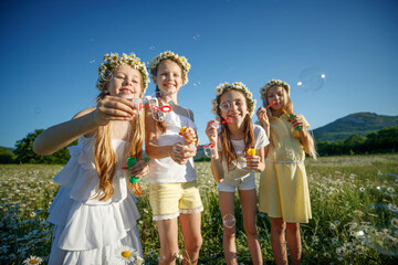 Children in nature. The girls play fun. High quality photo