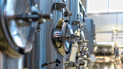 Metal tanks with beer at the brewery