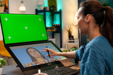 Digital editor using green screen and retouching software for pattern production on computer. Specialist woman with chroma key on display, mockup template and isolated virtual background