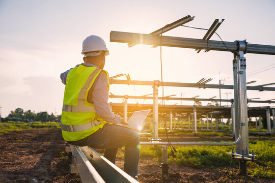 engineer inspect solar tracking machine in solar power plant; Monitor project of  automatic solar tracking