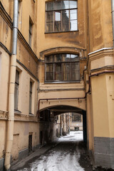 Arch inside courtyard of typical St Petersburg vintage apartment house