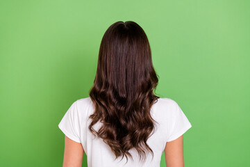 Back photo of brunette millennial lady hide face wear white t-shirt isolated on green color background