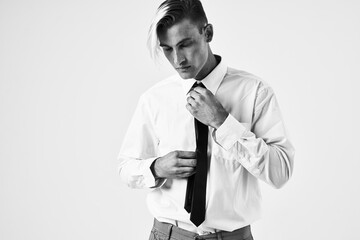 confident man with trendy hairstyle in white shirt